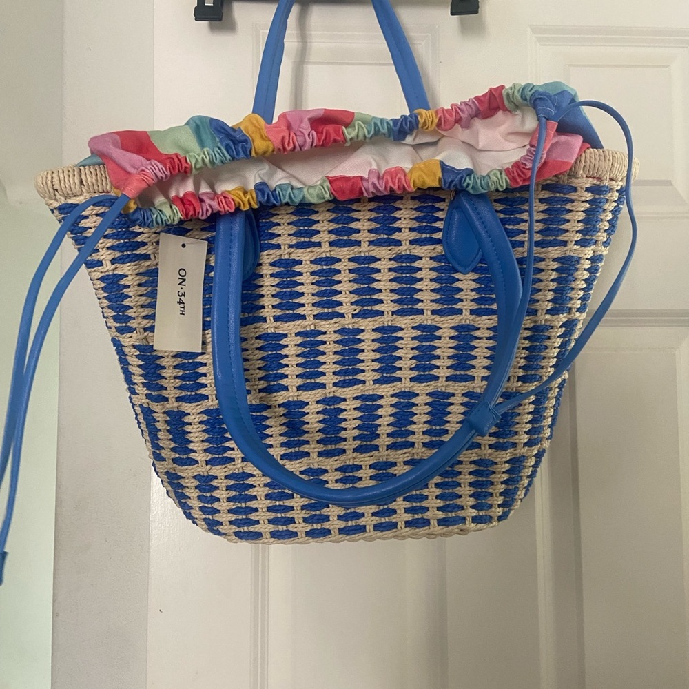Blue Woven Straw Tote with Multicolor Ruffle Trim by ON 34TH